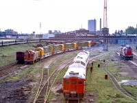 CN 6114 is at the CN Spadina engine facility in Toronto in June 1972. Behind the RDC's are new MLW locomotives destined for the FCP.
This photo is from a color negative.