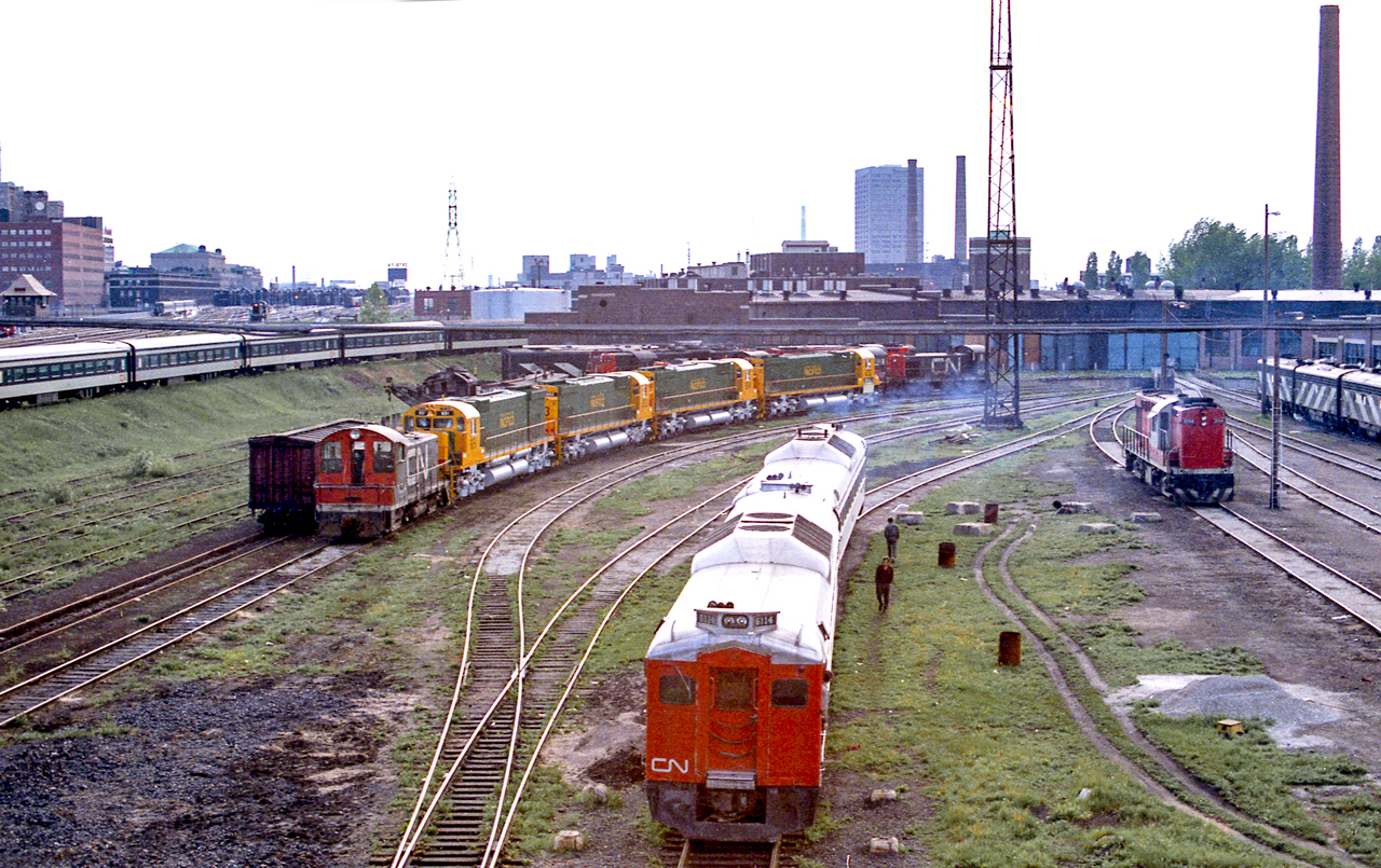 CN 6114 is at the CN Spadina engine facility in Toronto in June 1972. Behind the RDC's are new MLW locomotives destined for the FCP.
This photo is from a color negative.