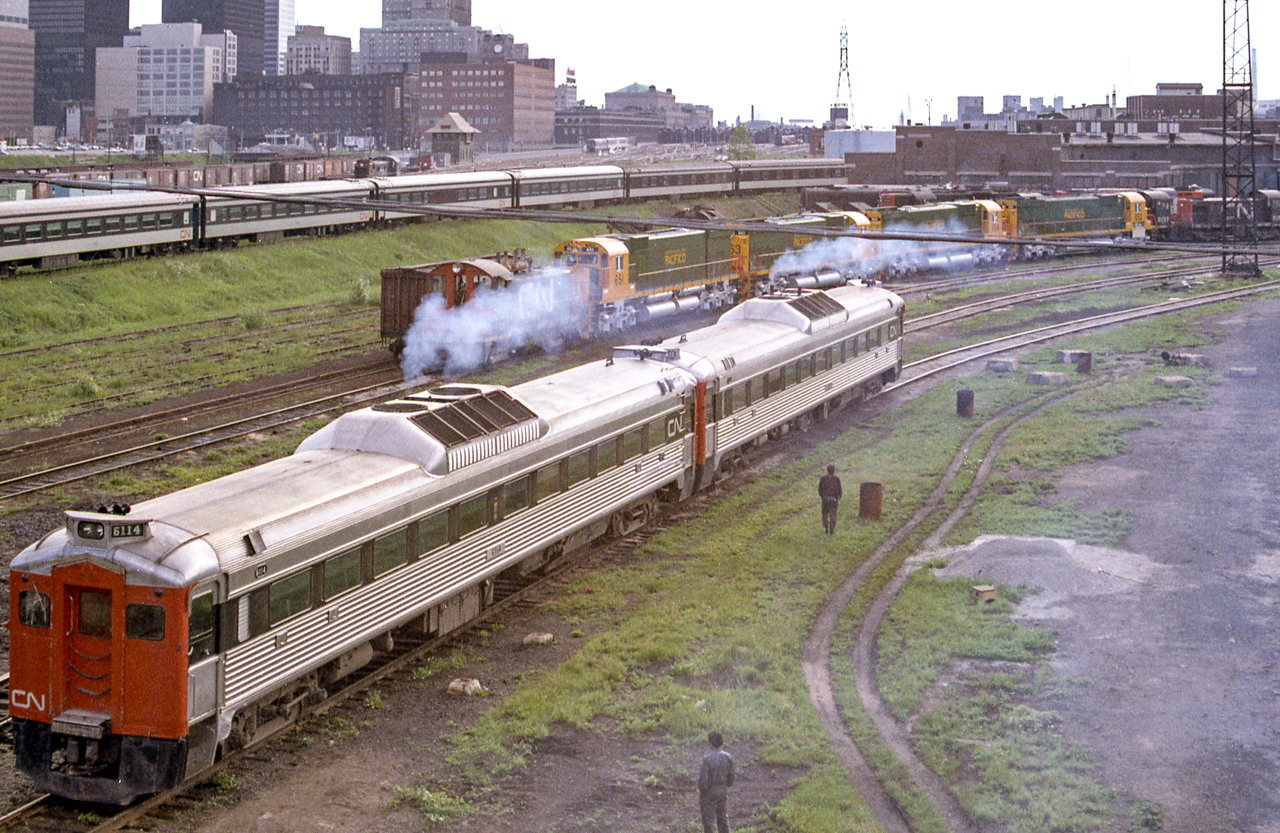 CN 6114 is in the foreground while new MLW locomotives for the FCP are behind it in the CN Spadina engine facility in Toronto in June 1972.
Bob.