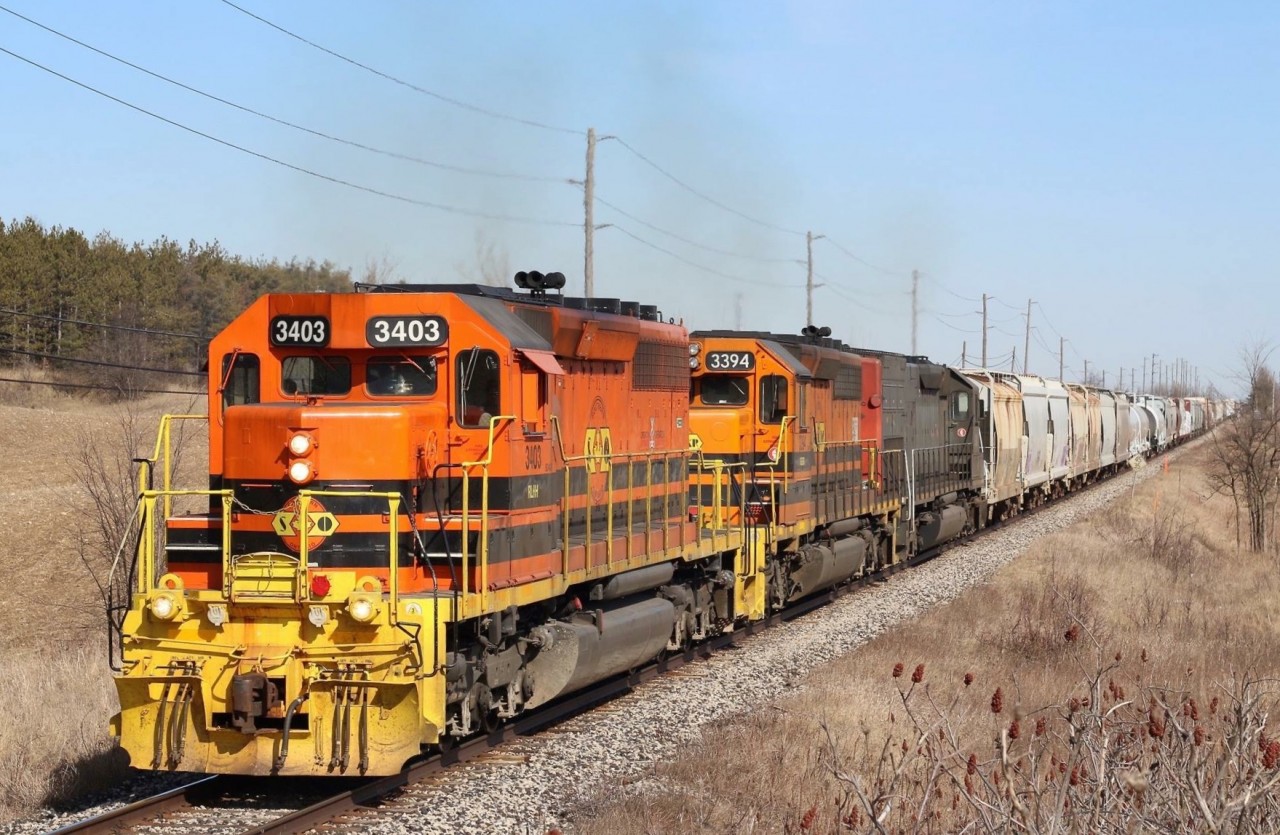 GEXR's newest arrival SD40-2 3403 began life as non Dash-2 Canadian Pacific #5516. Retirement would find it making a trip to Alstom in Montreal for a full rebuild into a SD40-2, including removal of its Canadian style steps in exchange for standard EMD steps. From there it went into the FURX lease fleet as number #3003, then eventually sold to GW where it was assigned to the Southern Ontario Railway. More motive power issues on the GEXR has found it relocated once again. Here we see 3403 leading Goderich - Exeter train 431 towards Stratford, just west of Acton. Just out of view in the background is a new GEXR customer having a spur being constructed, service should begin later this year.