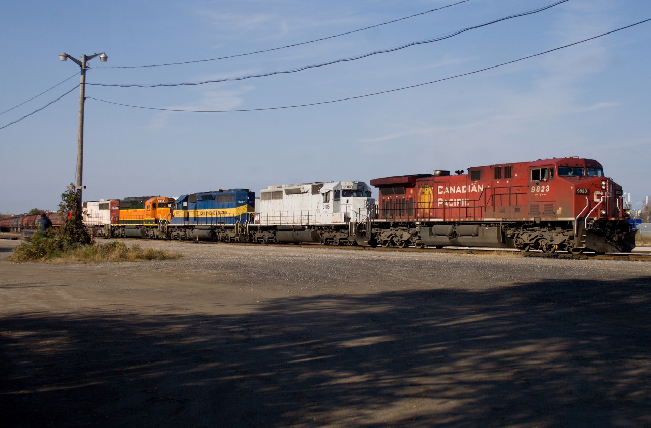 Downgraded in 1995, Aberdeen Yard was transformed into a steel and plastic trans-loading facility. With a colourful consist including AC4400CW CP #9823, SD-40M-2 CEFX #3105, SD-40-2 ICE #6217,SD-40-2 HLCX #6844 and SD-60 CEFX #6011, CP Train #255 lifts a cut of coil cars on October 30, 2011 before continuing north to Guelph Jct.