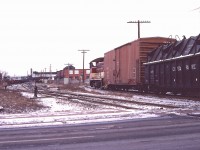 TH&B SW-9 56 swings onto the Beach Branch of the Hamilton Belt Line with a drag for Adams Yard on December 29, 1977. Fisher Yard can be seen in the distance at the left.