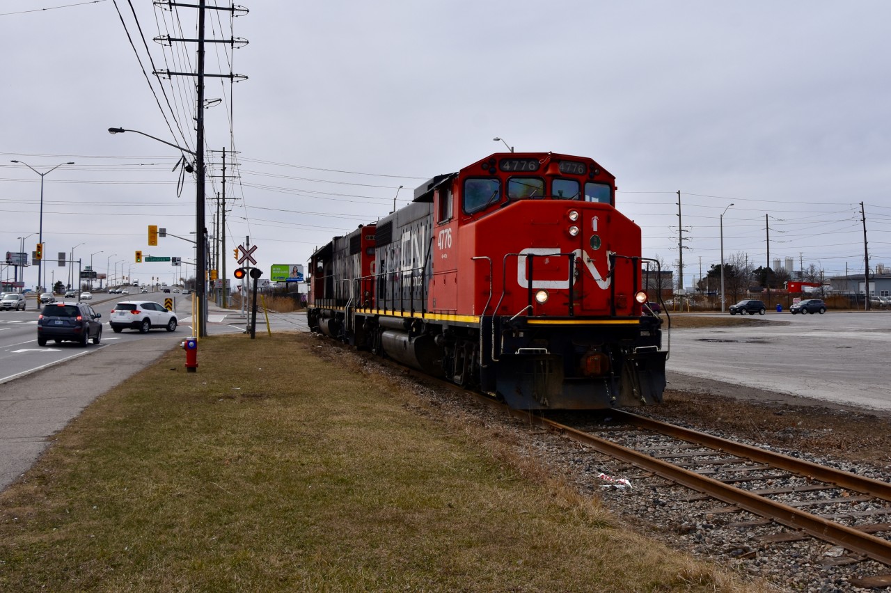 On Good Friday afternoon CN 559 is spotted running light up the Torbram Industrial Spur in Brampton ON. They have just crossed Bramalea Road and are paralleling Steels Ave on their way to lift one tank car from the Hubbert’s Processing and Sales Plant located just around the bend at 109 East Dr (someone please correct me if I’m wrong with the name of the factory) Then they will reverse back to the main not having to worry about going any farther up this long railway spur.