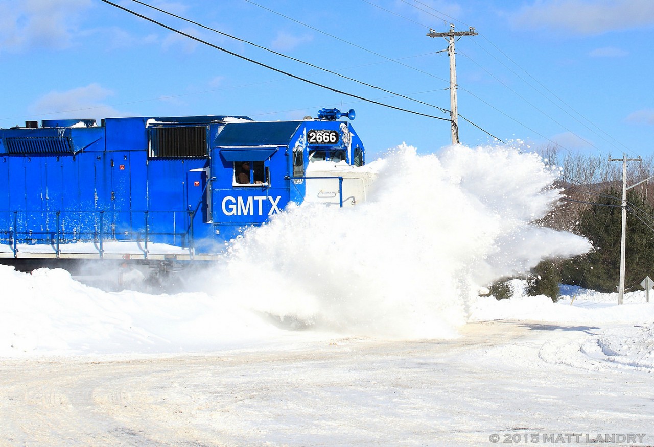Memories of winter!! After another snowstorm hit the area, GMTX 2666 leads an New Brunswick Southern Railway eastbound freight, as they bust through another snow filled crossing along the McAdam Sub. 2015 was a cruel winter for the railroads.