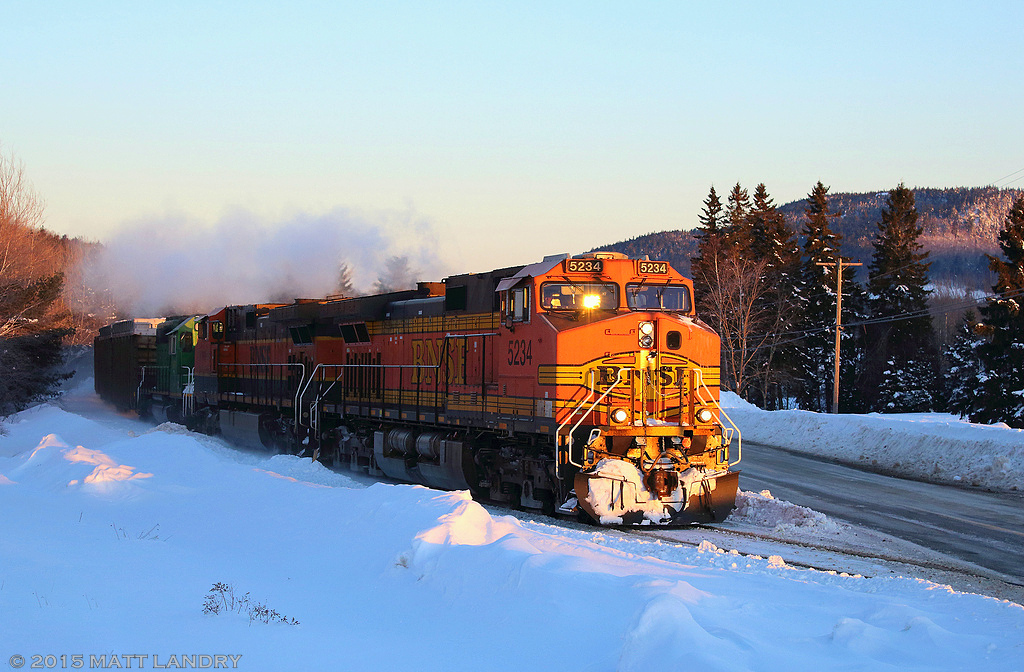 Back between 2012 and 2015, foreign power was a common occurrence on the New Brunswick Southern Railway. Near the end of February, 2015, BNSF 5234 leads an eastbound New Brunswick Southern Railway freight, as they head into the sunrise at Welsford, New Brunswick.