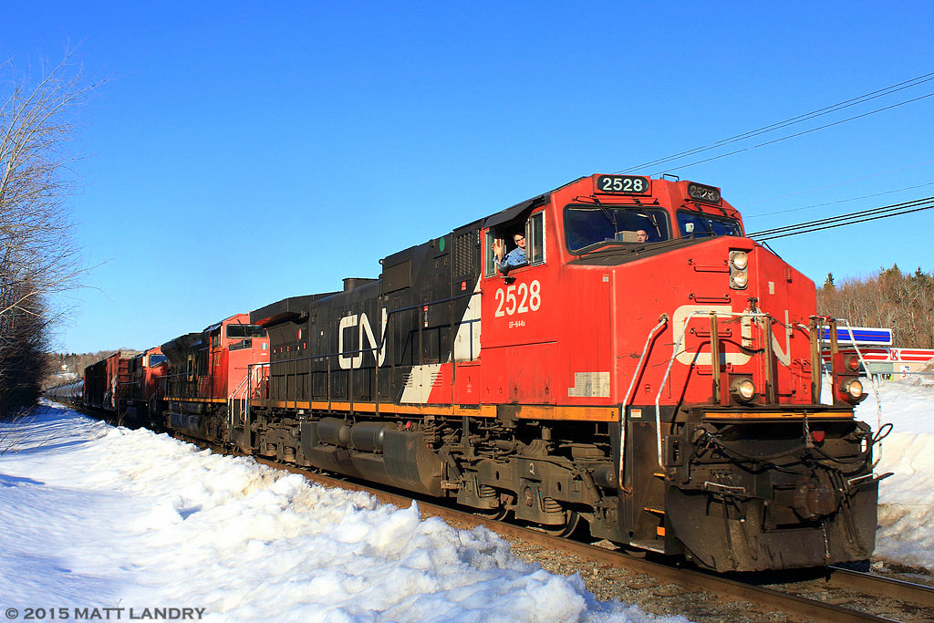 CN 2528 leads train 406 as they start their descent down into Saint John, New Brunswick. On board, the friendly hogger, and the photobombing conductor.
