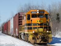 With 13 cars in tow, Quebec Gatineau 3102 heads east toward Staynerville, Quebec on the Lachute sub.  The GP40 was built in 1967 for New York Central.