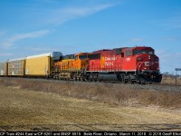 CP Train 244 w/CP 6261 on point and BNSF 6819 trailing roll past the Belle River mileboard on March 11, 2018.  Once he cleared I had to call in to the CP Police as there was a dragging cut lever banging off the ties and crossings. Would have hated to heard that it came off and hit a car or worse yet, someone standing trackside. They stopped somewhere around Tilbury to inspect and carried on from there.