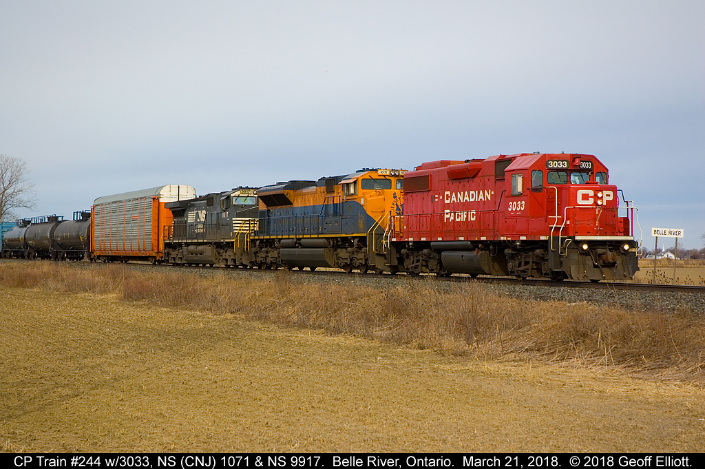 Thanks to a H/U via Earl Minnis from Mike Harding late the night before that 244 was leaving Elkhart with the NS 1071 leading.  This gave me some motivation to watch what was going on this morning.  After tracing as in Windsor @ 0800 I figured I'd have a chance.  Eventually, with numerous people giving status updates, 244, with new CP leader #3033 (hot plate equipped!) got rolling and I was able to snag a shot of the train just east of Belle River.  Nice colorful consist on a bit of a drab day but the sun peaked out just long enough to shed a little light on the subject.  That's another NS Heritage I can cross off the list.