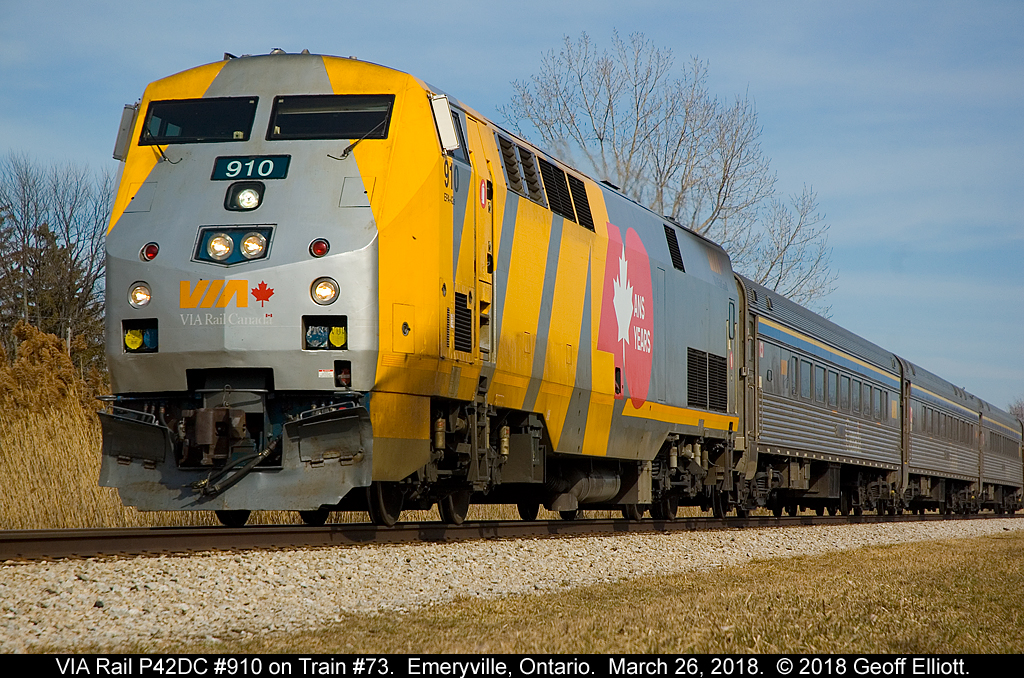 Sporting a 'getting dirty' 40th Anniversary Logo, VIA #910 races through Emeryville, Ontario on March 26, 2018.