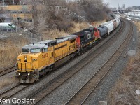 "Strike-through" leaser GECX 9473 leads CN 527, the Southwark transfer, towards Taschereau yard.