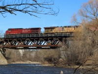 It’s not a spot that many rail fans venture to, mainly as it’s hidden away and a bit of a tight shot, but I have always taken a liking to the old Credit Valley Railroad bridge in Streetsville. Originally single tracked it was later widened to allow for a second main. It’s not hard to become one with nature here even though you are pretty much in the middle of the city. Here we see CP 9818 west running on the block of train 241 with line UP 5500 in the lead, as luck would have it another Uncle Pete was in the mix on this train as well. Everything here is still looking pretty dormant but in a few weeks the spring colours will begin once again to take over.