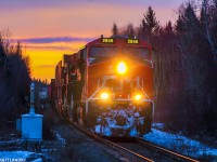 During a colorful sky at sunrise, an AC leads Q121, shortly after departing Moncton, New Brunswick. Next up, the crew change at Edmundston, New Brunswick, about 225 miles away, by rail. 