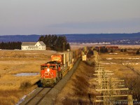 CN 8947 leads a 13,920 foot eastbound Q120, as they approach Amherst, Nova Scotia at sunrise