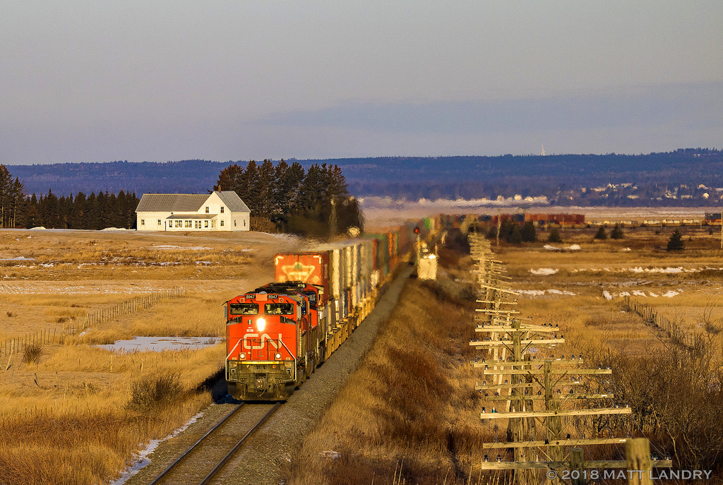 CN 8947 leads a 13,920 foot eastbound Q120, as they approach Amherst, Nova Scotia at sunrise