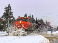 The day after a 30cm snowfall in Southern New Brunswick, CN 2341 leads train 406, as they hit a small snow pile, approaching Saint John, New Brunswick.