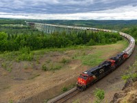 After an hour hike two and from, a 3 hour wait, and a busted camera, a CN eastbound potash train rounds the bend after crossing the massive Salmon River Trestle. This is a new vantage point for me. Was worth the trek. 