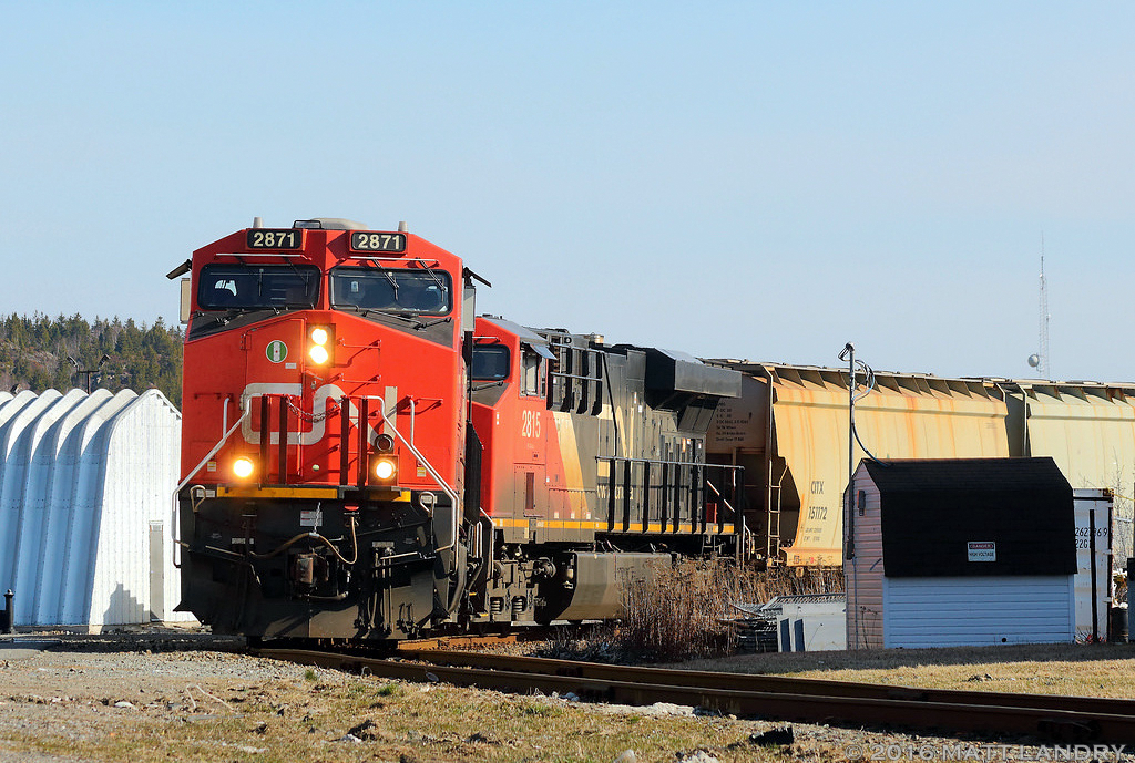 After arriving at Saint John, New Brunswick, CN B730 heads onto the spur over to the port at Courtnay Bay. Seen here, making a semi sharp 90 degree turn, paralleling Crown St, in Saint John. Good thing they only travel about 5mph.