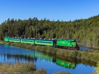 NBSR 6319 leads a passenger train along the CN Sussex Sub towards Renforth, New Brunswick, for the Dragon Boat Festival. They make three trips from Harbour Station in Saint John to Renforth, then make three trips in the afternoon to pick up passengers to head back to Saint John. Seen here, passing by the "unnamed lake". True story. 