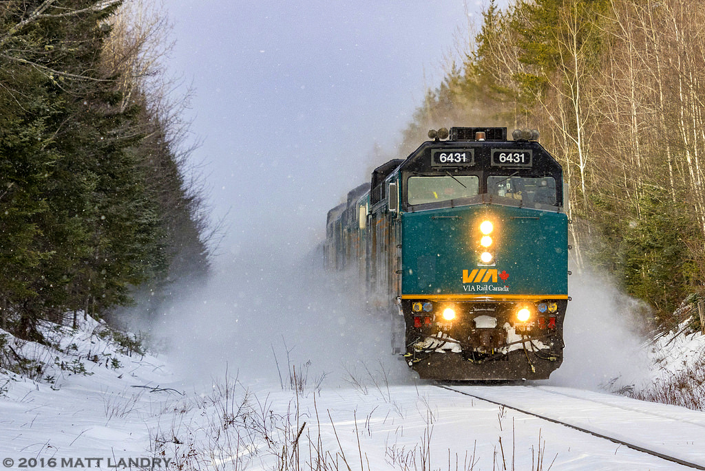 VIA eastbound 14, "The Ocean" passes through Cannan Station, New Brunswick, approaching Pacific Jct. This train features the last Budd car set of the 2016 holiday season. Amidst all the snow flying, the Budd set is there....