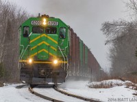 After setting off a "pole car" at Fredericton Junction, NBSR 6200 continues on it's way out of the Jct, approaching Tracy, New Brunswick, as the snow starts to fall. 