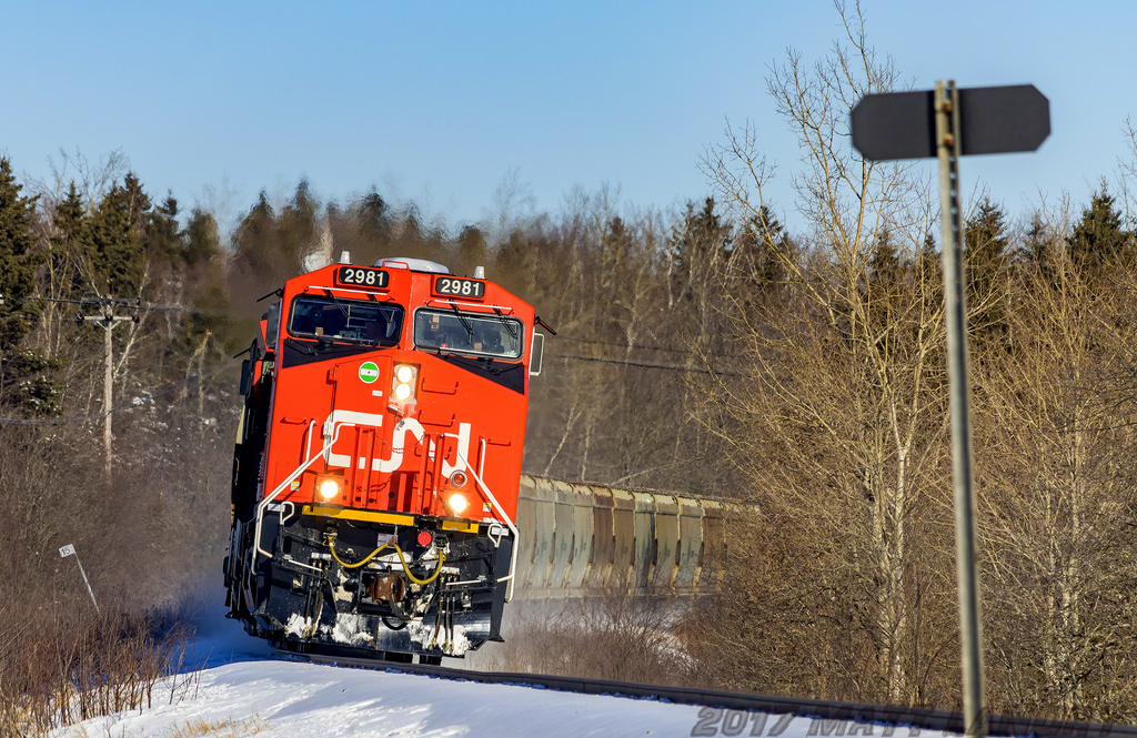 CN 2981 leads a potash train towards Saint John, rounding the bend at River Glade, New Brunswick.