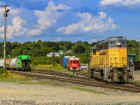 After CN 1501 parks at the shop track, NBSR 917 does a reverse movement back over to the shops, with an NBSR caboose sitting over on the left, for the next trip to St Stephen. 