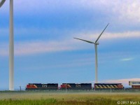 Heading through a bit of fog & mist, CN 120 heads by some turbines, as they approach Amherst, Nova Scotia. 