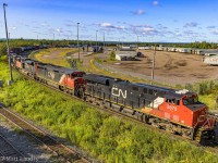 CN 2875 heads under the overpass at Gort, as they put their train together at Moncton, New Brunswick, with a six unit lashup. 