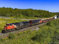 CN 8894 has no issues keeping track speed, as they lead a small 407, rounding the bend at Springhill Jct, Nova Scotia. 