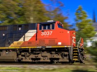 Panning CN 3037, as they lead westbound train 406 at Rothesay, New Brunswick.