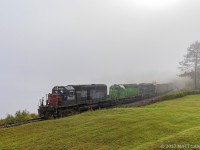 NBSR 6340 leads a New Brunswick Southern Railway westbound freight, as they round the edge of the Saint John River, which is pretty much non existent due to the heavy fog blanketing the area. 
