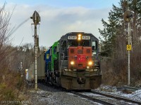 NBSR 6340 leads a New Brunswick Southern Railway westbound freight past an old set of signals at mile 4.4 of the Mattawamkeag Sub, shortly after a crew change at McAdam, New Brunswick. 