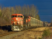 In some nice storm light, CN 2444 leads train 406, as they head through Apohaqui, New Brunswick. 