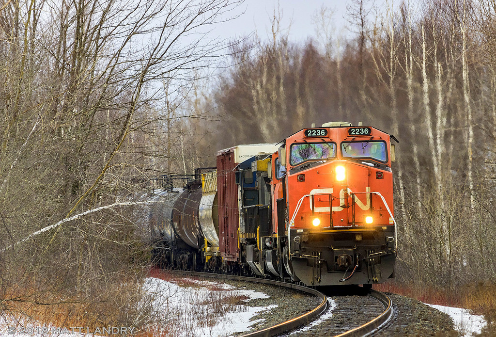CN 2236 leads eastbound train X474, as they round the bend approaching Berry Mills, nearing their final destination of Moncton, New Brunswick. GECX 9142, an ex CSX unit, is trailing in this consist.