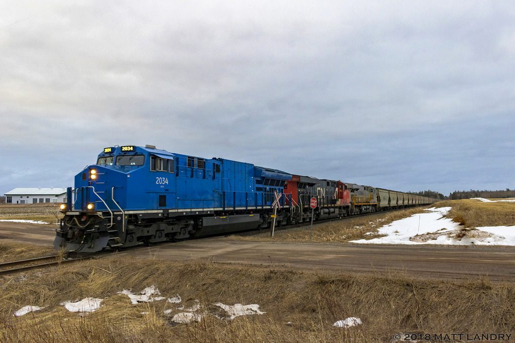 GECX 2034 leads a stellar lashup, with CN L594's train, eastbound, at Boundary Creek, New Brunswick, approaching Fundy, where they will enter CN's Gordon Yard. CN 2851 and CREX 1510 make up the rest of the lashup. I had to wake up at 4am for this shot, but it was worth it. Was trying to find a spot where I could get more of a side shot of the consist. This was the best I could do.