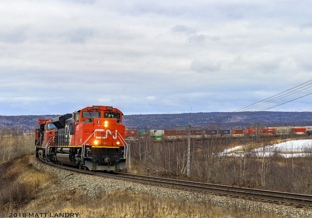 CN 8950 leads stacker train Q120, as they round the horseshoe curve at Dorchester, New Brunswick. Unfortunately, the vegetation has grown in this spot over the years, making it a bit trickier to nab the photo I'm looking for.