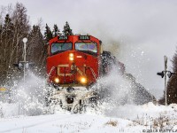 CN 2526 leads train 406 through a snowbank the day after a snowstorm hit the area, as they approach Sussex, New Brunswick. 