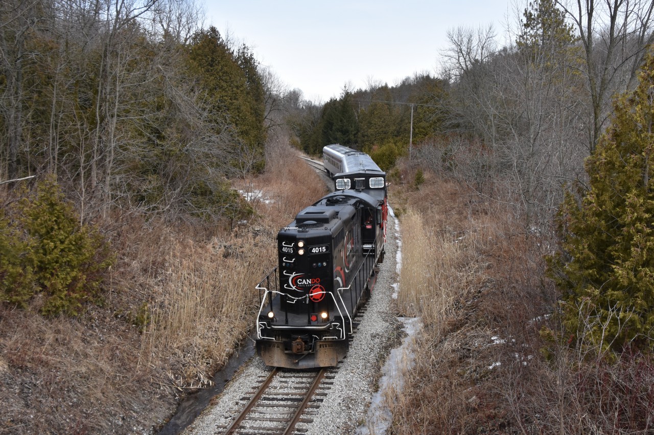 Likley the end of an era! On Saturday February 24 2018, CCGX 4015 ran the most likley last Credit Valley Explorer from Orangeville to Slengrove and back. In the recent news that CANDO plans to cease operations completely on this line, it was said that the last Credit Valley Explorer ran February 24 and I made sure to go out and catch it! 
Here we see the Credit Valley Explorer passing through the Forks of the Credit Provincal Park south and about to pass under the small wooden bridge used by hikers checking out all the different trails as well as people walking their dogs and letting them enjoy all the different scents that could be found here at Forks of the Credit. 
For those of you who missed this, the window is still open. CANDO plans to operate freight on this line until June 30th unless another railway takes over which in my honist opinion, I doubt will happen because it’s very hard for any railway to make profit when you have to pay for 50+ miles of track in land taxes to only serve about half a dozen consumers so if I were you, I’d get my shots when the window is still open. Good Luck!