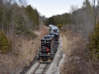 Likley the end of an era! On Saturday February 24 2018, CCGX 4015 ran the most likley last Credit Valley Explorer from Orangeville to Slengrove and back. In the recent news that CANDO plans to cease operations completely on this line, it was said that the last Credit Valley Explorer ran February 24 and I made sure to go out and catch it! 
Here we see the Credit Valley Explorer passing through the Forks of the Credit Provincal Park south and about to pass under the small wooden bridge used by hikers checking out all the different trails as well as people walking their dogs and letting them enjoy all the different scents that could be found here at Forks of the Credit. 
For those of you who missed this, the window is still open. CANDO plans to operate freight on this line until June 30th unless another railway takes over which in my honist opinion, I doubt will happen because it’s very hard for any railway to make profit when you have to pay for 50+ miles of track in land taxes to only serve about half a dozen consumers so if I were you, I’d get my shots when the window is still open. Good Luck! 