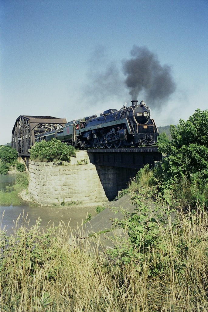 It was a bright and very warm Saturday back on the 24th of July 1976 when I staked out a spot just off Seaway Haulage Road on the east side of the Welland Canal in order to grab a shot of CN6060 (Toronto bound)  on excursion as it was thru the summer months back then. It ran on Wed and Sat. And did a good business. I'm in the grass here along what I think is the remains of the old Third Canal and the CN Iron Bridge.  Great memories!!! And my personal RP photo number one thousand.  Finally.