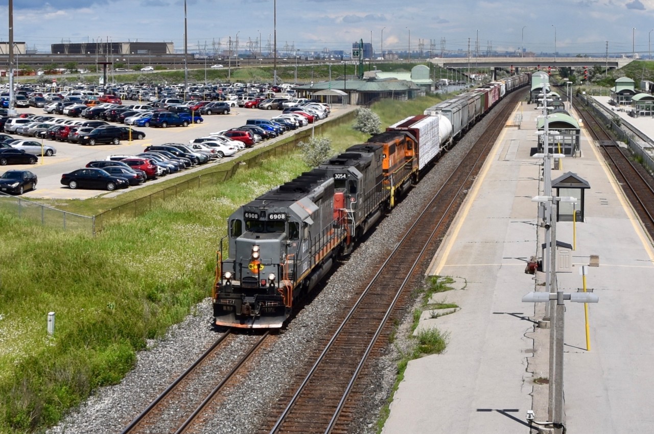 GEXR 431 is heading home to Stratford after a run to CN Mac Yard in Vaughn to interchange with CN . They will most likely be making a pit stop in Kitchener as well to drop off some freight cars at the Kitchener Yard. Leading was a leased unit QGRY 6908 (substituting for GEXR 3393 who was out of service at the time) followed by an ex-SP sd45 3054 and GEXR 3394. They are passing through Bramalea GO Station in Brampton and about to pass under Steels Ave.