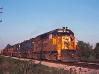 A Chessie eastbound heads into the morning sun behind a mixture of GP40s and GP38s.