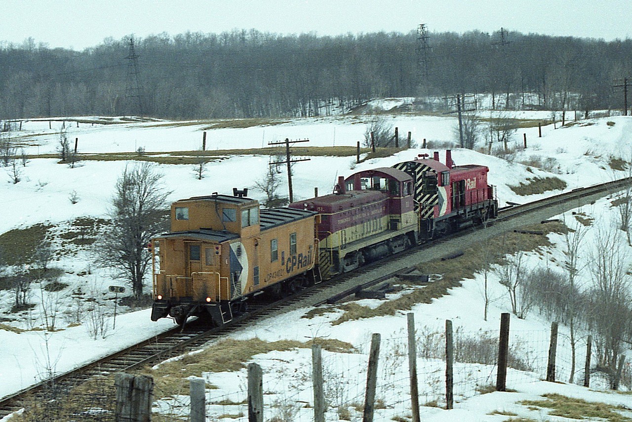 Not the sort of image I usually submit, but I rather like this 'going shot' of the power running light from Aberdeen to Guelph Jct. CP 8157 leads TH&B 51 and van 424021 as they will go up and work the Junction traffic. The view is from the Old York Rd just east of Hwy 6.