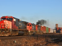 M38331 25  accelerates upgrade through Brantford with CN 2559, GTW 59933, and CN 2002 leading the way