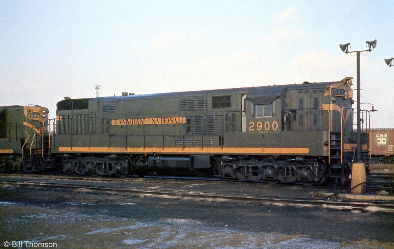 CN and CP both purchased the 6-axle 2400hp Fairbanks Morse H24-66 "Train Master" in the 1950's in the form of one unit each, but only CP made a follow-up order. CN's only Train Master was delivered as 3000 (later renumbered 2900), and built at FM's plant in Beloit, Wisconsin in 1955 and shipped to Kingston later that year for completion. In its brief career with CN it was used for many purposes, briefly in Montreal and mainly around Toronto. Here 2900 is pictured sitting in Mimico in 1961, probably in transfer service (Mimico to Danforth Yard), or helper service on Scarborough Hill. The unit was retired in February 1966, and scrapped in 1968.