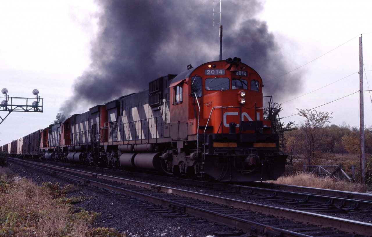 A trio of MLW "big C's", led by C630m 2014, thunder out of Aldershot in the late fall of 1983.