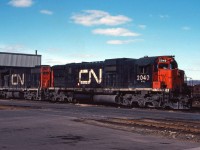 CN C630m 2040 and GP38-2 5536 rest in the sunshine outside the Stuart Street diesel shop on a bright spring day in 1980. While I don't have any records, these units likely arrived from Montreal on container/piggyback train 251 and will probably depart for Sarnia before the morning is over.
