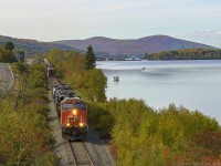 CN 2344 is eastbound, leading train M306 along the scenic Lac Baker, about 24 miles north west of Edmundston, New Brunswick. Unfortunately, I was probably a week or two early to get the Fall colors in full force, but they still look alright. 