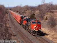 With only the lack of snow suggesting that springtime has arrived, the loaded Saskatchewan to New Brunswick potash unit train rolls through Lovekin on a sunny Saturday. Powered by four units - CN 2818 and 3118 up front, 2958 as mid-train DPU, and 2812 on the rear - this is certainly one of the heaviest trains on CN right now (in this part of Canada anyway).